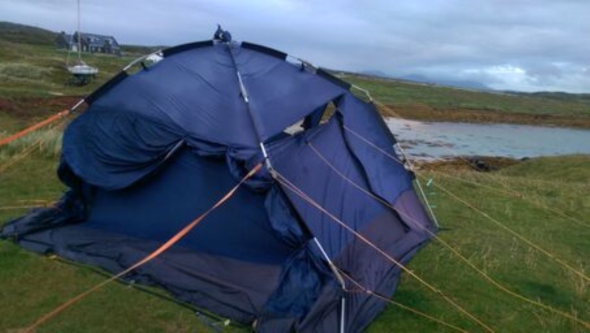 Tethering the drive away awning to terra firma in the face of the gale blowing in from the Atlantic to Clifden - a blue task. Also blue, the task of throwing the awning away when the wind ripped a hole through it making it unusable.